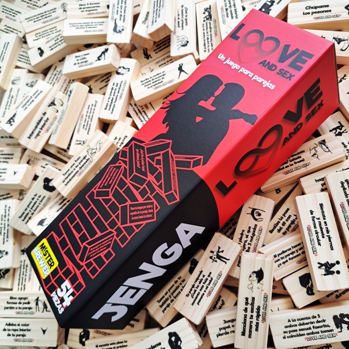 Red and black Jenga box resting on a pile of printed wooden blocks.