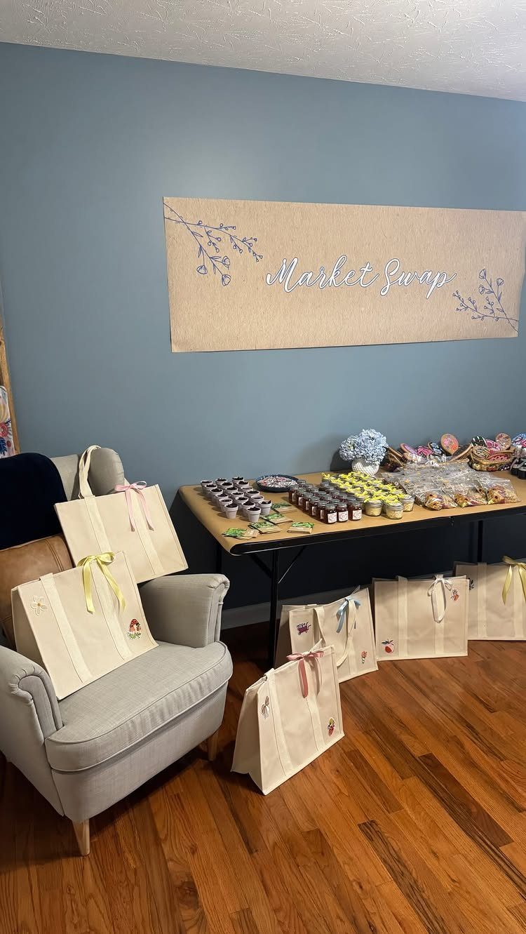 Market Swap themed party setup with a burlap banner, food table, and gift bags.