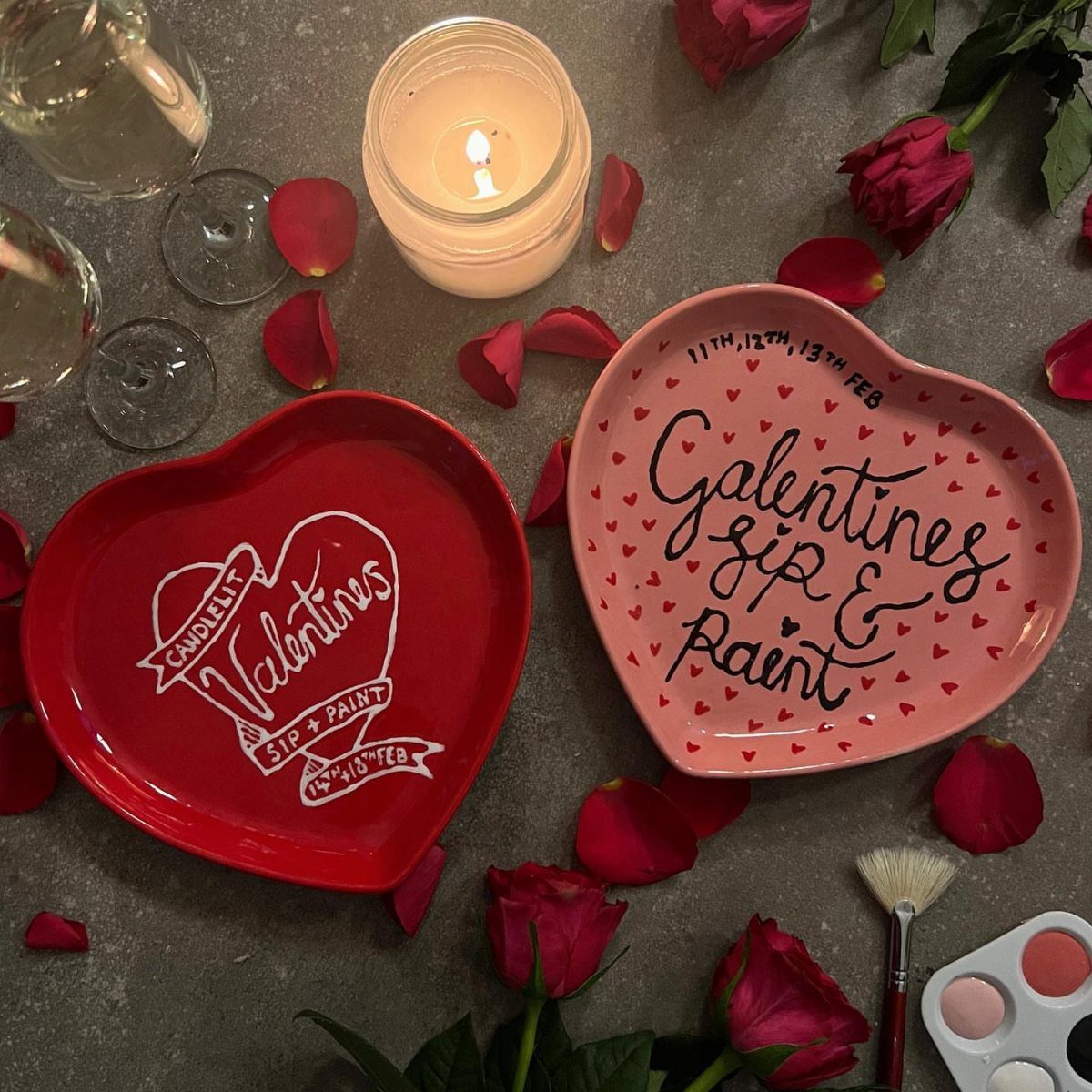 Heart-shaped plates for a Galentine's sip and paint party with roses and paint.