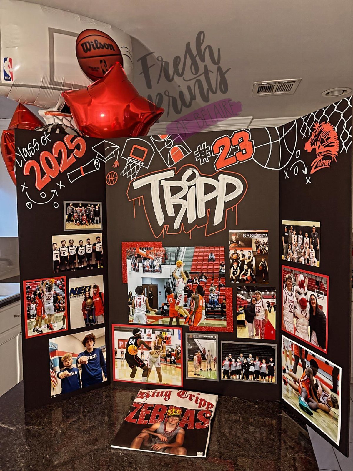 Basketball themed graduation backdrop with photos, red balloons, and Class of 2025 text.