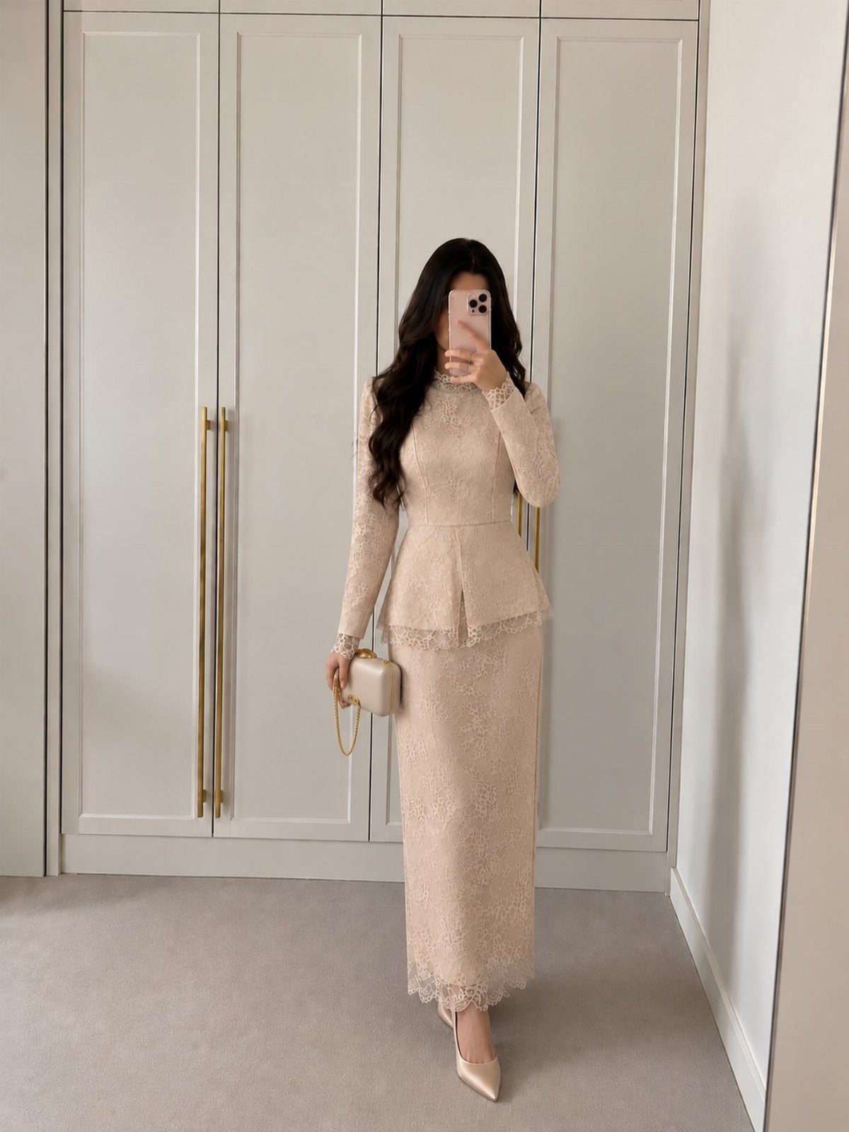Woman wearing a long beige lace dress with a peplum waist and heels.