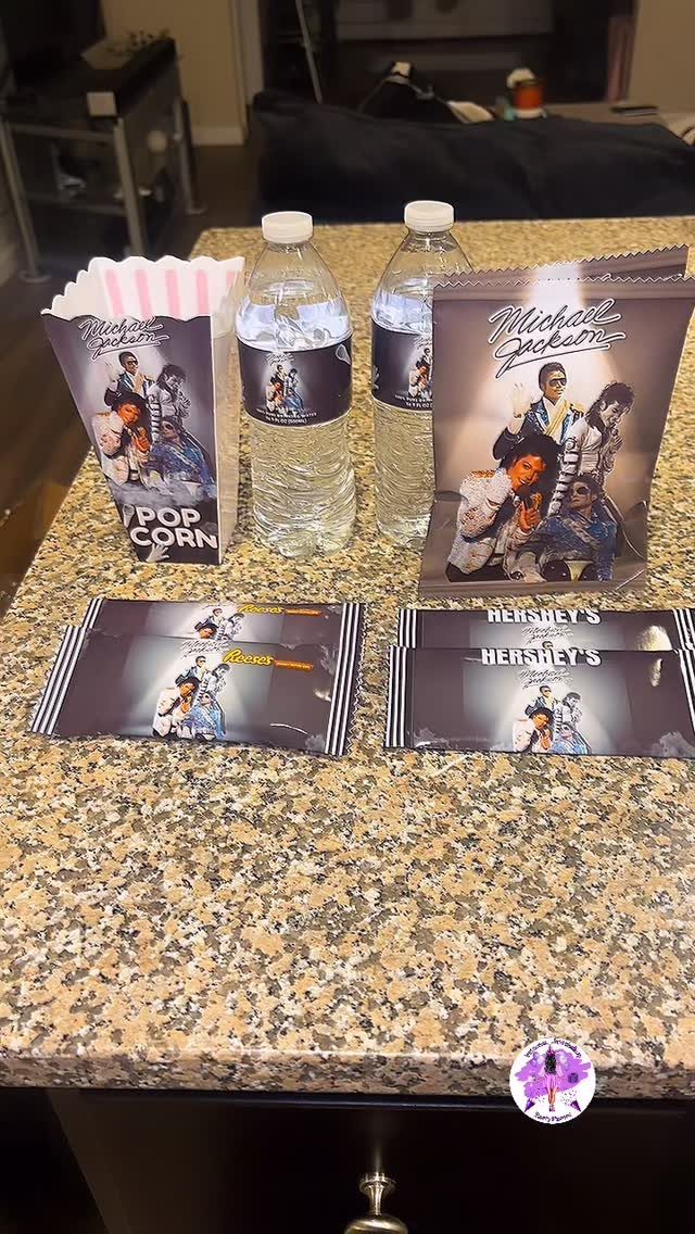 Michael Jackson themed party favors including popcorn, water bottles, and chocolate bars.