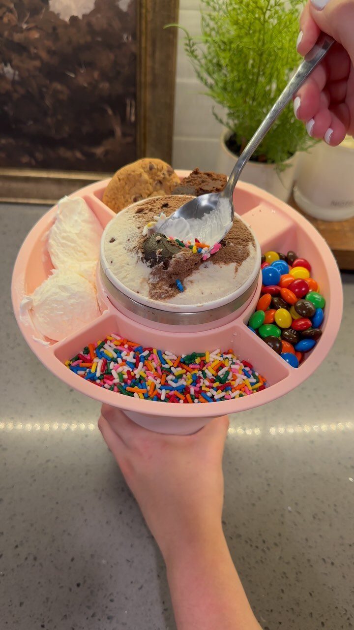Ice cream sundae kit in a pink divided tray with various toppings.