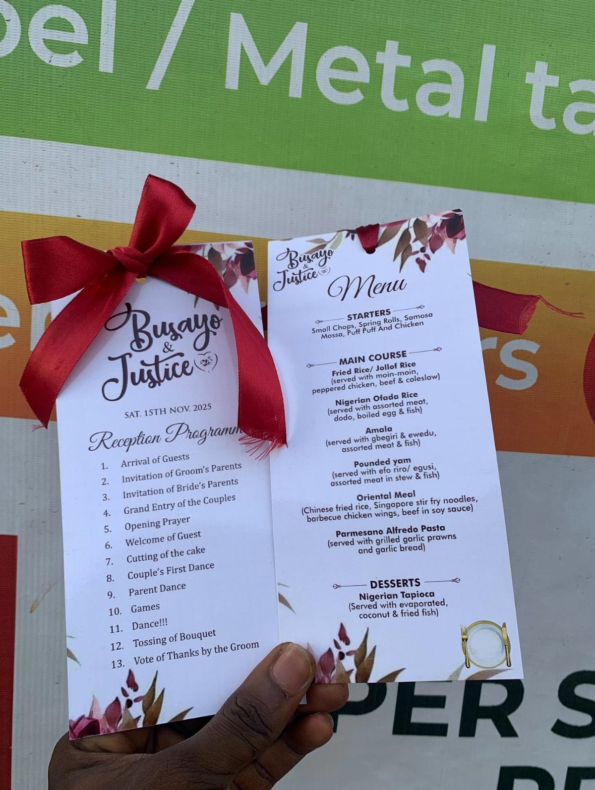 Reception program and menu cards with red ribbons for Busayo and Justice wedding.