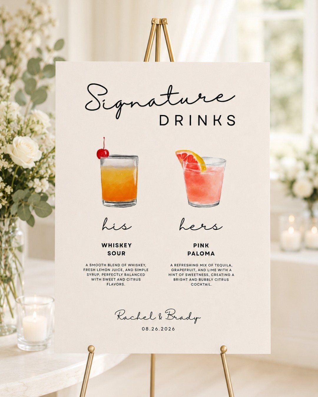 Signature drinks sign on a gold easel featuring two colorful cocktail illustrations.