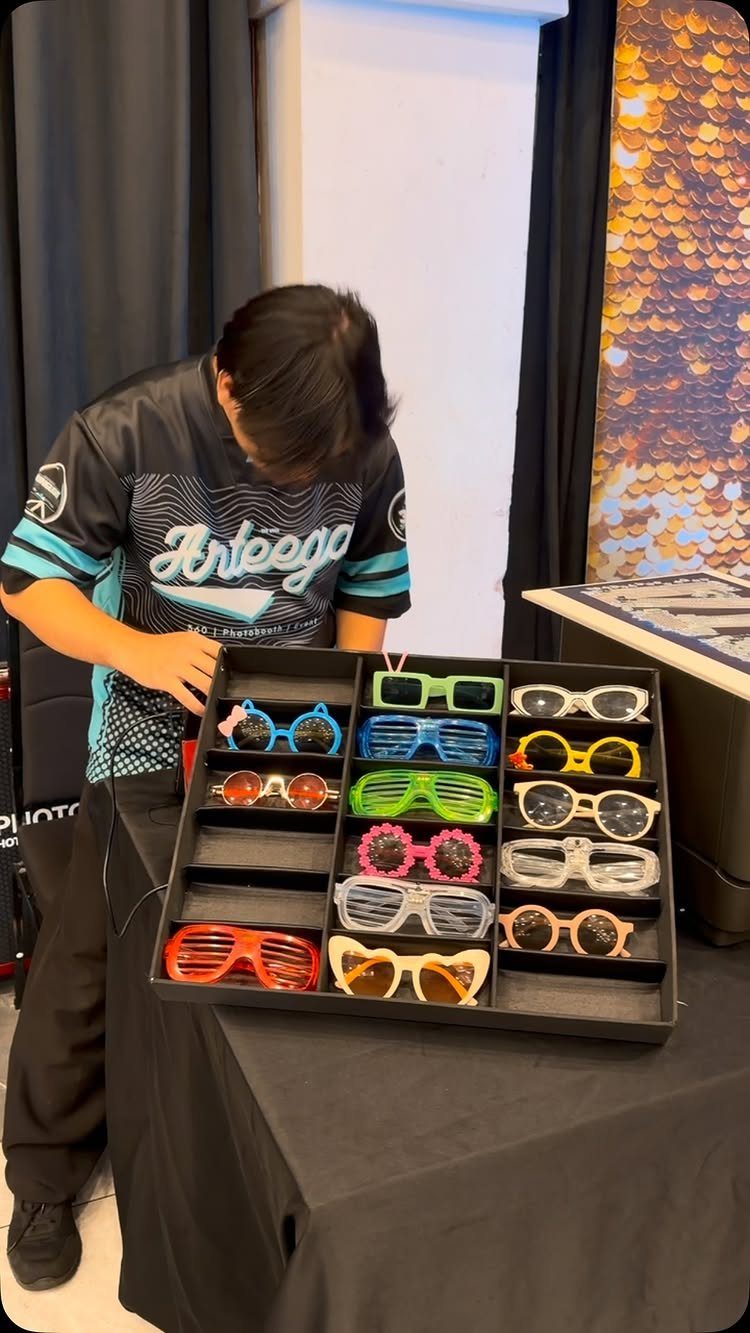 Colorful novelty glasses in a black organizer tray on a table