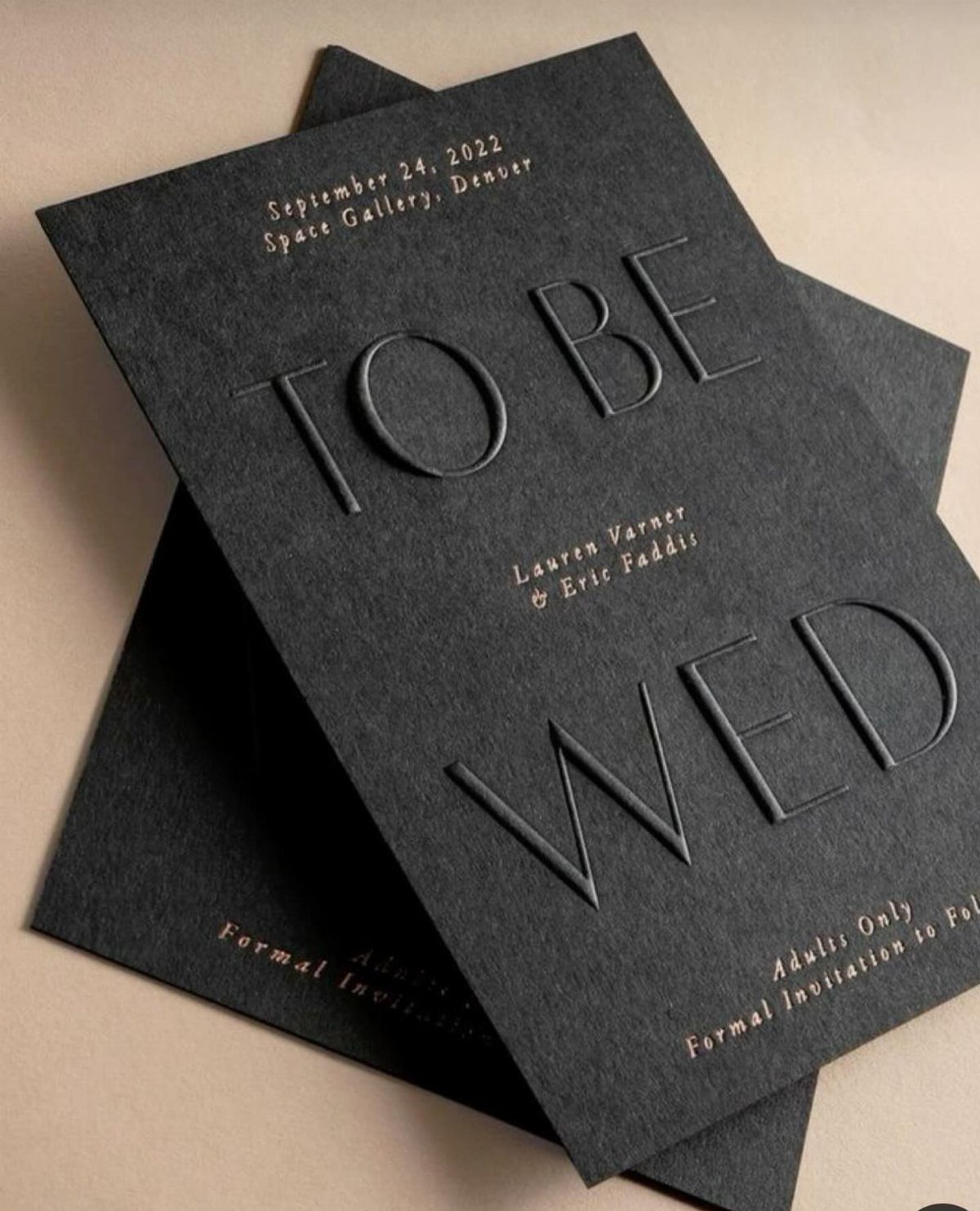 Black wedding invitations featuring bold embossed typography reading TO BE WED in sans-serif.