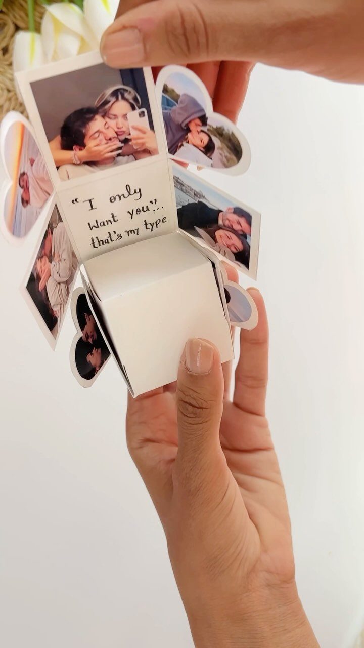 Handmade exploding gift box with couple photos and a romantic handwritten note.
